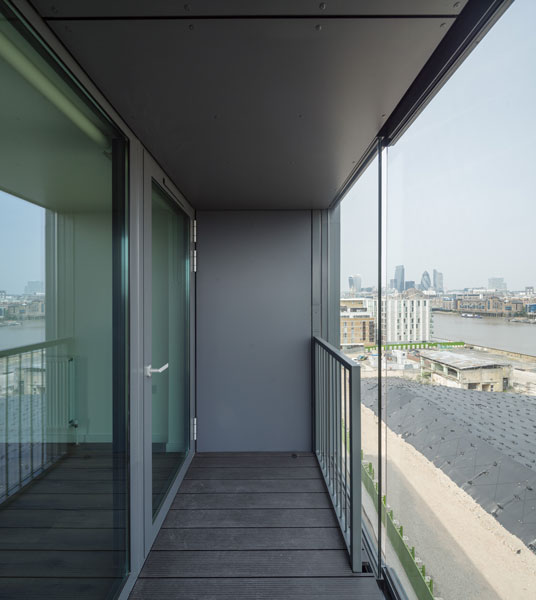 Architectural photography of timber flooring running through to the balcony. 2 of 15.
