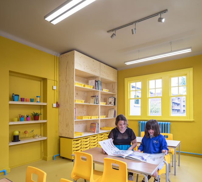 Photograph of classroom with yellow colour scheme. 5 of 14.