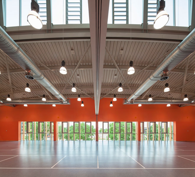Upper level hall provides views to the landscape. 6 of 20