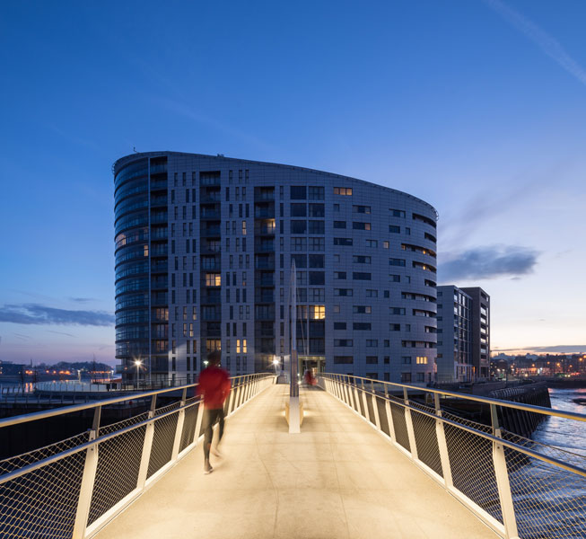 Night photograph of a jogger on the bridge. 8 of 15.