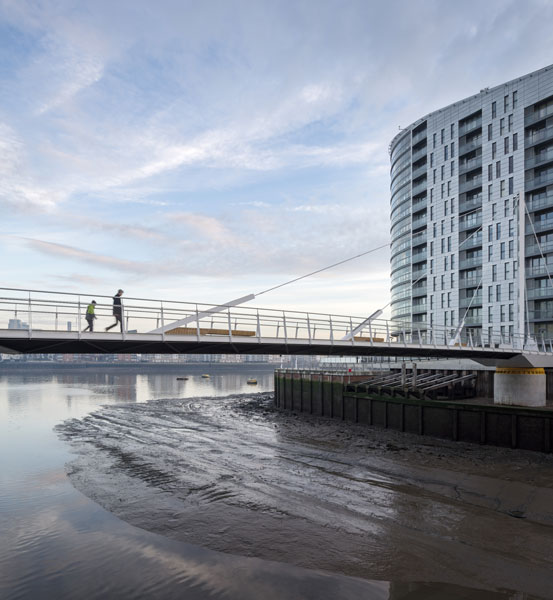 Slender architecture photographed against river. 13 of 15.