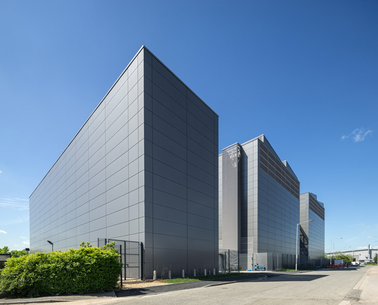 Rear view showing metal-clad facades, 02 of 09