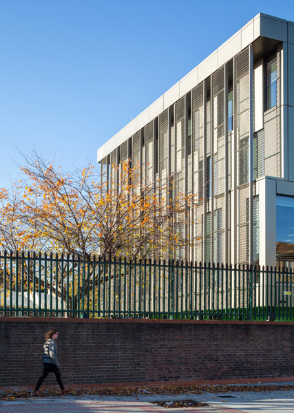 School with metal cladding showing relationship to street, 02 of 24