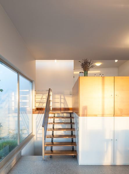 Interior photo showing mezzanine level with timber stair, 03 of 11