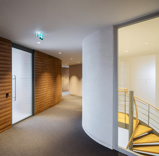 Corridor with veneer panels and view of the spiral staircase, 05 of 14