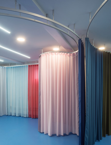 Coloured fabric drapes define interior, 07 of 09