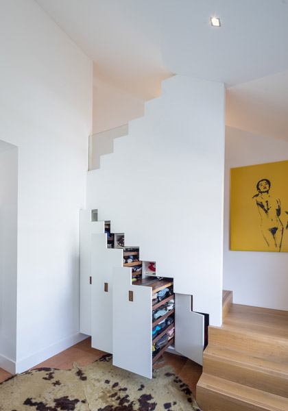 Staircase featuring storage and leather floor, 15 of 17